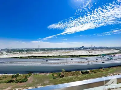 an overhead view of a highway with cars on it at Balcony Studio Haven in Riviera in Dubai