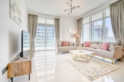 a living room with a couch and a table at New 2 bedroom full sea view in Dubai