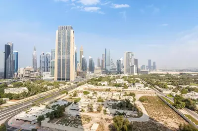 an aerial view of a city with skyscrapers at Clse Elegance Redefined Luxury 1 Bedroom Apartment with Premium Facilities in Dubai