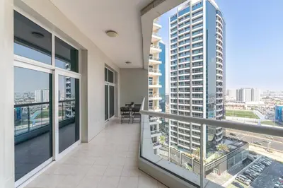 an apartment balcony with a view of a city at Vogue Al Fahad Tower, Al Barsha Heights near Mall of The Emirates, Walking Distance to DIC Metro Station, Two Bedroom Apartment with Balcony and Access to all Amenities in Dubai