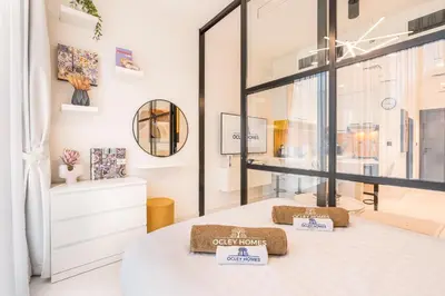 a room with a table with two pillows on it at Stylish Contemporary Home in JVC with Chic Interior in Dubai
