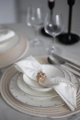 a white plate with a napkin on a table at Modern and Cozy 1BR in Business Bay in Dubai