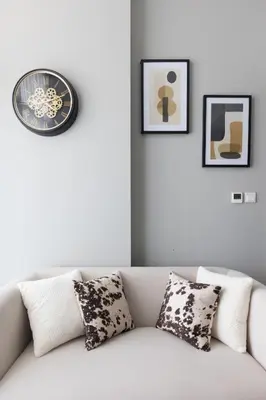 a white couch with pillows in a living room at Modern and Cozy 1BR in Business Bay in Dubai