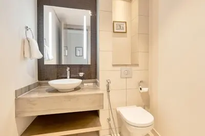 a bathroom with a sink and a toilet at Spacious 3BHK in Paramount Tower B with Stunning Views-6204 in Dubai