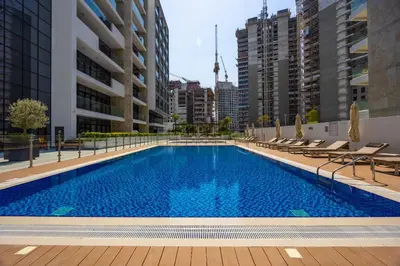a swimming pool in the middle of a building at Urban Oasis - Cosy Studio Retreat in Dubai