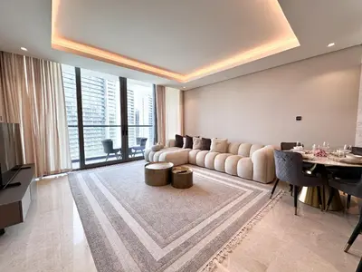 a living room with a couch and a table at Chic 1-Bedroom in Sterling Tower, Downtown Stay - 17AB05 in Dubai