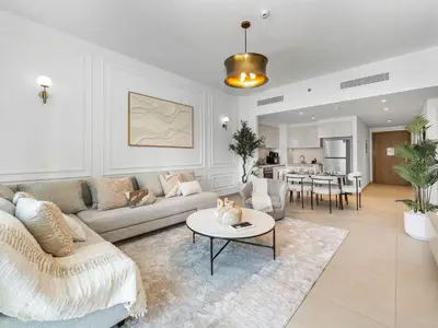 a living room with a couch and a table at Apartment in Downtown Dubai in Dubai