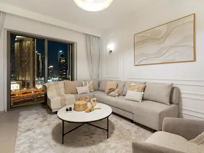 a living room with a couch and a table at Apartment in Downtown Dubai in Dubai