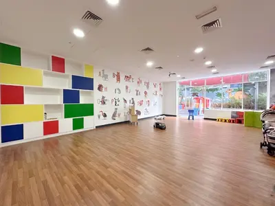 a large room with colorful walls and wooden floors at Luxurious 2BR in Vezul Residence, Business Bay - 13AB01 in Dubai