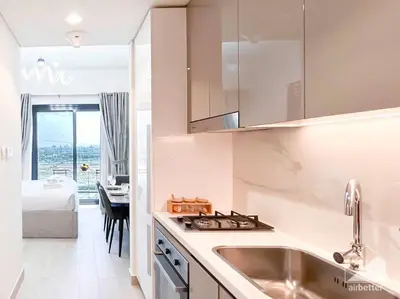 a kitchen with a sink and a counter top at Amazing Studio with Balcony & View Riviera Meydan in Dubai
