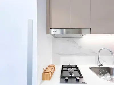 a kitchen with a stove and a sink at Amazing Studio with Balcony & View Riviera Meydan in Dubai