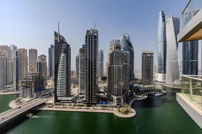 a view of a city with a river and buildings at Spacious 3BDR Apartment in Marina with Office in Dubai