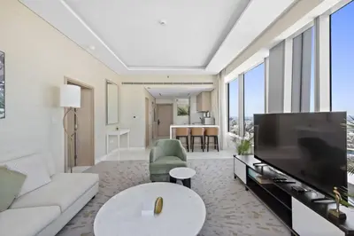 a living room with a large flat screen tv at Stunning 1-BR Apartment In Heart Of The Palm in Dubai