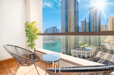 a balcony with chairs and a view of the city at LUX The Luxurious Central JBR Suite 2 in Dubai