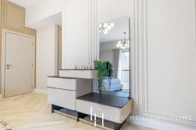a dressing room with a mirror and a white dresser at LUX The Luxurious Central JBR Suite 2 in Dubai