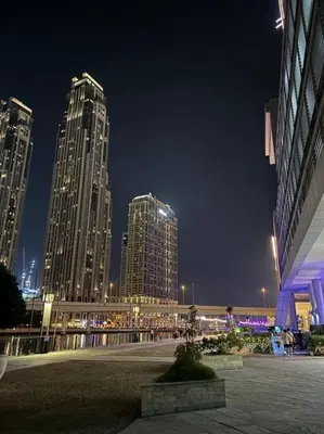 a city skyline at night with tall buildings at Layali - Chic 1BR with Balcony in Business Bay in Dubai