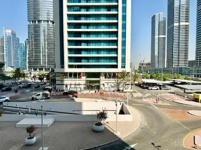 a view of a city with tall buildings at Cosmos Living Sleek and Stylish GCV2 in Dubai