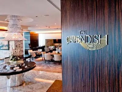 a restaurant with a sign that reads the emerald restaurant at Cosmos Living Sleek and Stylish GCV2 in Dubai
