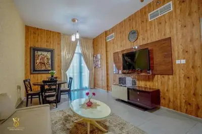 a living room with a table and a tv at Luxury apartment in Dubai marina 5 min walk to JBR Beach-3BHK Apartment in Dubai