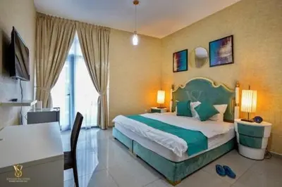 a bedroom with a bed and a table and a desk at Luxury apartment in Dubai marina 5 min walk to JBR Beach-3BHK Apartment in Dubai