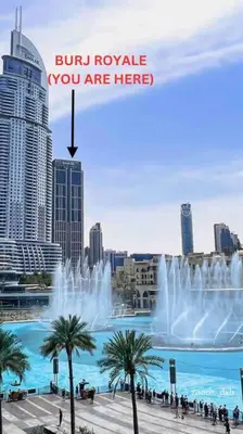a picture of a fountain in a city at Glow Sky Suite Trendy 1BR- Dubai Mall Access by Maxx Value Homes in Dubai
