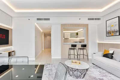 a living room with a couch and a table at Gorgeous 2BR APT in Dubai Marina with Canal View in Dubai