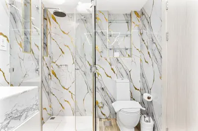 a bathroom with a toilet and a shower at Gorgeous 2BR APT in Dubai Marina with Canal View in Dubai