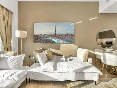 a hotel room with a bed and a dining room at Luxury 1BR 5min to Dubai Mall Burj Khalifa View from pool in Dubai