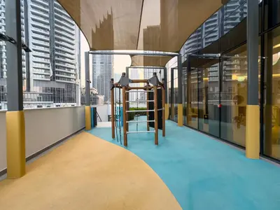 a view from the balcony of a building with a ladder at Luxury 1BR 5min to Dubai Mall Burj Khalifa View from pool in Dubai