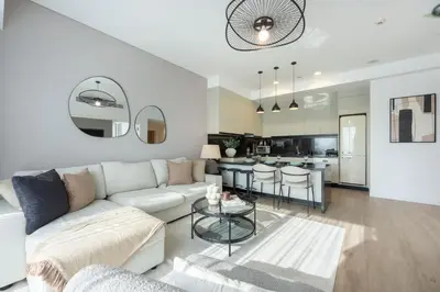 a living room with a couch and a table at StayShort - Grand Stay in this 1 Bedroom Flat that Sleeps 4 in Dubai