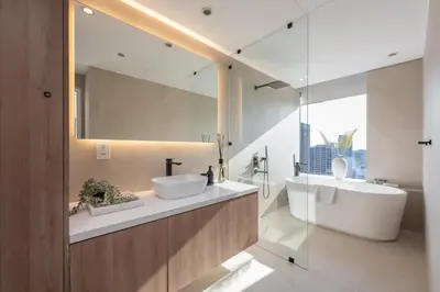a bathroom with two sinks and a mirror at StayShort - Grand Stay in this 1 Bedroom Flat that Sleeps 4 in Dubai