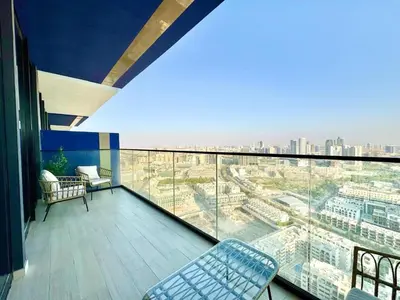 a balcony with a view of a city at Modern 1br In Jvc Pool, Balcony & Free Parking in Dubai