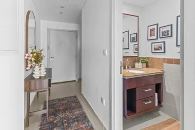 a bathroom with a sink and a mirror at Stylish 1BR with Iconic Burj and Fountain Views, Free Luxury Airport Pick Up Service in Dubai