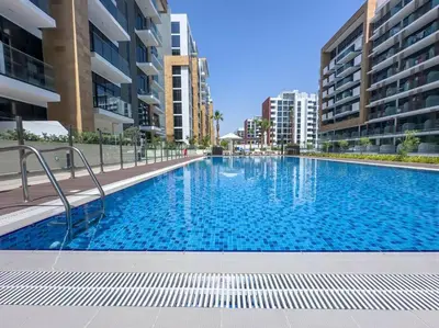 a large swimming pool in the middle of a building at Naseem Elegant Studio Escape in Al Merkadh in Dubai