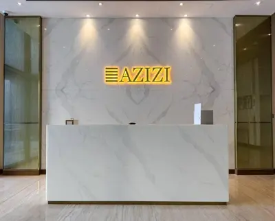 a large marble wall with aania sign on it at Naseem Elegant Studio Escape in Al Merkadh in Dubai