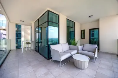 a living room with a couch and a table at Luxury 3BD study in Missoni with private elevator in Dubai