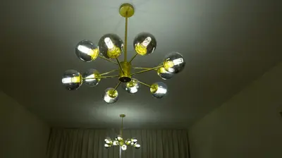a chandelier hanging from a ceiling in a room at Boho Chic Haven Burj Khalifa view in Dubai