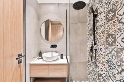 a bathroom with a sink and a mirror at Stylish Studio APT with Pool and Gym in Dubai