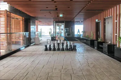 a room with a game of dominoes on the floor at Upscale 3BR Apartment in Bayz Tower, Business Bay by Deluxe Holiday Homes in Dubai