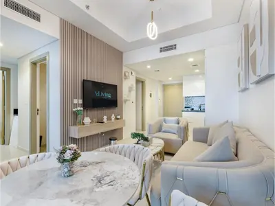 a living room with a couch and a table at ALiving Elegant 2BR plus Maid's Room I Aykon City, Business Bay- 4016 in Dubai