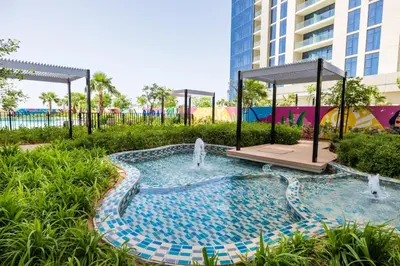 a pool at a resort with a fountain at ALiving Elegant 2BR plus Maid's Room I Aykon City, Business Bay- 4016 in Dubai