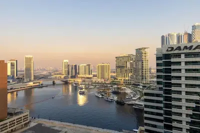 a view of a river in a city with buildings at Waves - Canal-View Elegance 1BR Apt in Reva Residences in Dubai