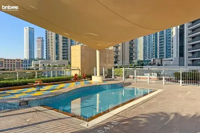 a swimming pool on the roof of a building at bnbme - Chic Downtown Studio Near Burj Khalifa Dubai Mall w Pool Gym Concierge in Dubai