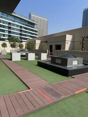 a view of a building with a field of grass at Marina Quays West - Modern One Bedroom in Marina in Dubai