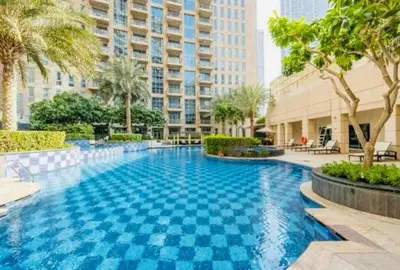 a swimming pool in the middle of a building at The Skyline Suite Luxury Downtown Retreat in Dubai