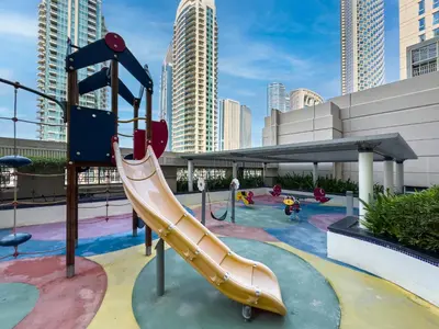 a playground with a slide in a city at The Skyline Suite Luxury Downtown Retreat in Dubai