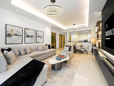 a living room with a couch and a table at WonderfulStay at Paramount Residences - Highest Infinity Pool - Burj Khalifa View - Brand New Luxury Apartments in Dubai