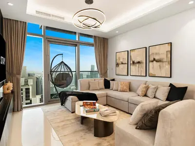a living room with a couch and a table at WonderfulStay at Paramount Residences - Highest Infinity Pool - Burj Khalifa View - Brand New Luxury Apartments in Dubai