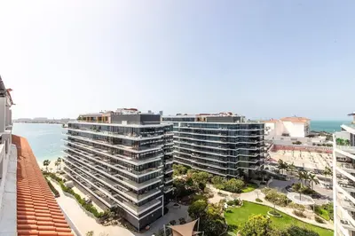 an aerial view of a large building next to the ocean at Palm Jumeirah Studio Sea View Royal Amwaj in Dubai