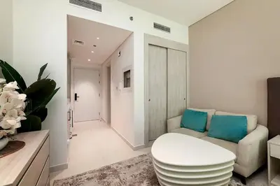 a living room with a couch and a table at Private Beach Palm Jumeirah Studio high floor in Dubai